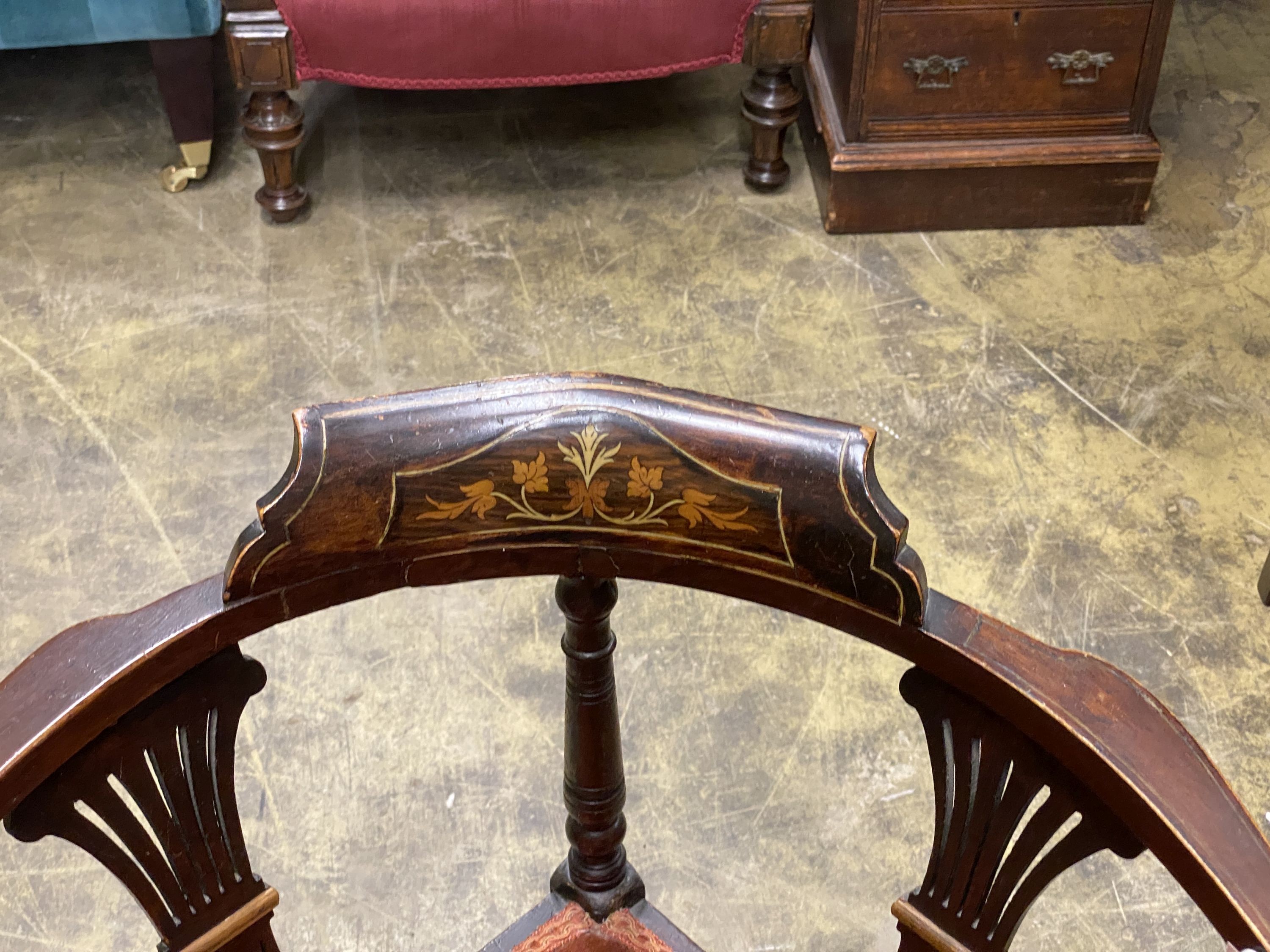 An Edwardian inlaid mahogany corner elbow chair